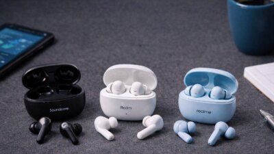 Budget wireless earbuds placed on a desk for everyday use